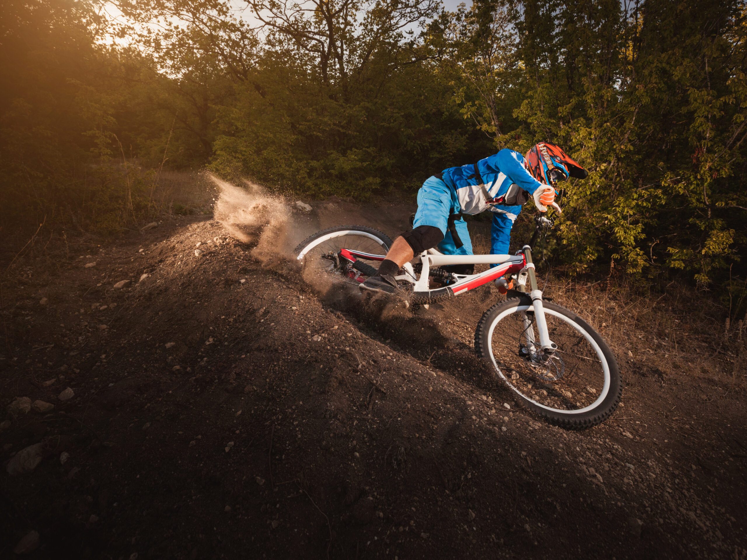 Mountain Bike cyclist riding forest track. Downhill biking.